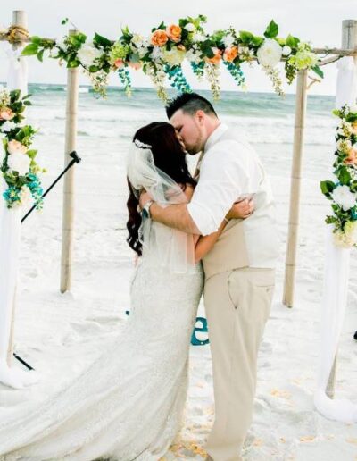 beachside wedding kiss